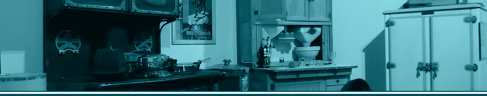 Vintage kitchen exhibit at The History Museum showcasing historical appliances and decor.