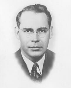 Black and white portrait of a young man in vintage attire, representing historical figures.