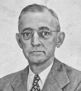 Ancient historical figure portrait at The History Museum, showcasing vintage attire and glasses.