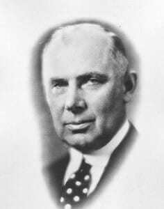 Vintage black and white portrait of a distinguished man, early 20th-century photograph for history museum exhibit.