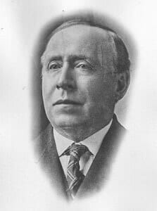 Portrait of a distinguished man in early 20th-century attire at The History Museum.