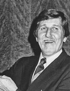 Historical man in a suit at The History Museum, showcasing the museum's exhibits and community heritage.