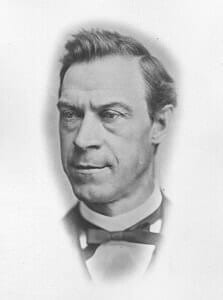 A historical portrait of a 19th-century man in formal attire.