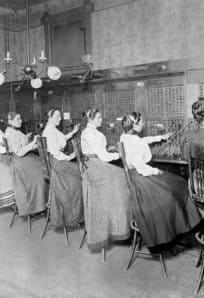 Vintage classroom with women working on early telecommunications at The History Museum.