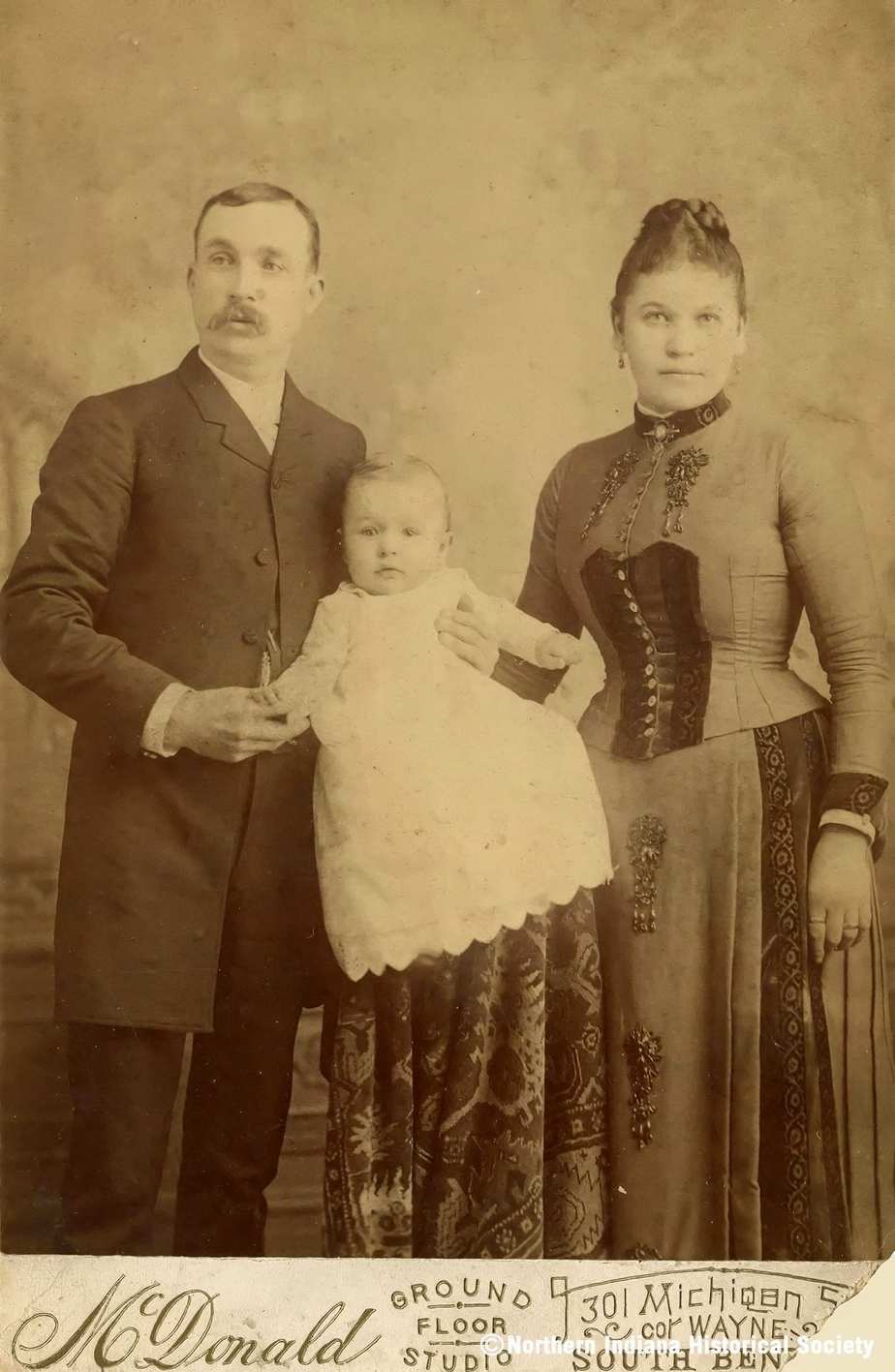 Roman and Pauline Luzny Family portrait of a man, woman, and a baby, vintage photograph.