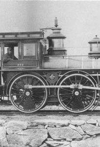 Old steam locomotive from the early 20th century at The History Museum, showcasing transportation history.
