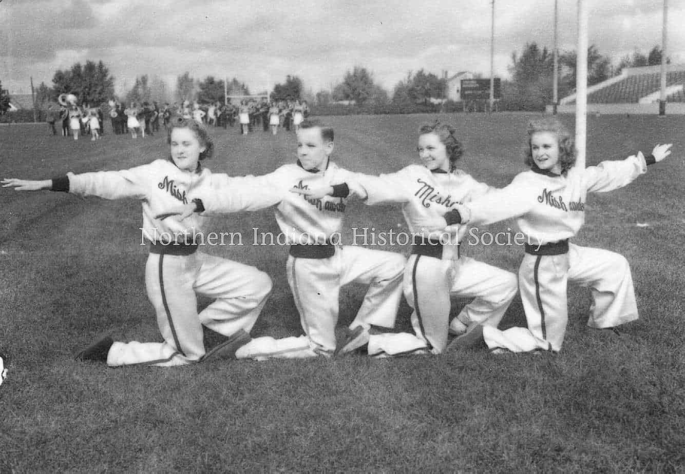 Children performing a vintage cheerleading routine at The History Museum exhibit.