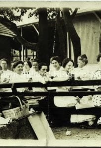 Vintage photo of women enjoying an outdoor gathering at The History Museum.