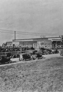 Parking lot with vintage cars in front of The History Museum, Northern Indiana Historic Society historic site, early 20th-century architecture.