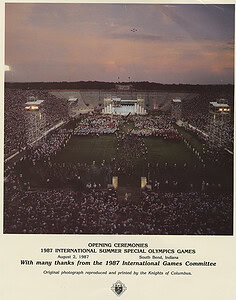 1987 International Summer Olympics opening ceremony at South Bend, Indiana, with large crowd and stage setup.