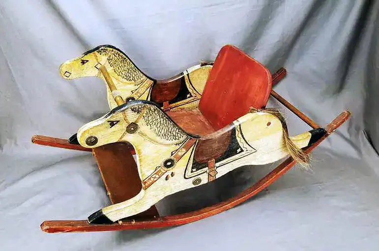 Shoefly rocker Vintage wooden rocking horse with painted details and saddle, displayed as a historic toy from The History Museum collection. Perfect for exploring childhood and antique toy history.