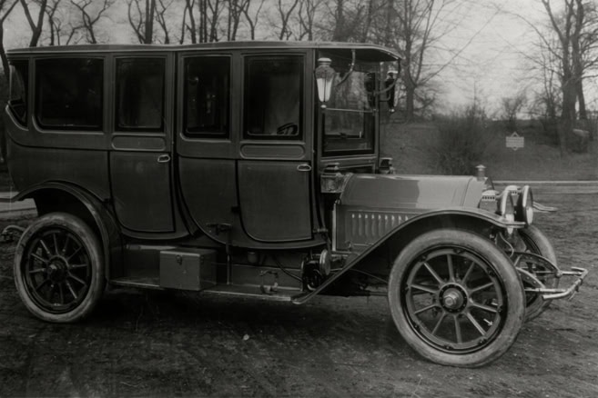 Vintage early 20th-century automobile on display at The History Museum, showcasing historical transportation and industrial heritage.