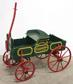 studejr Studebaker model wagon displayed at The History Museum, showcasing vintage transportation history and early automotive innovations.