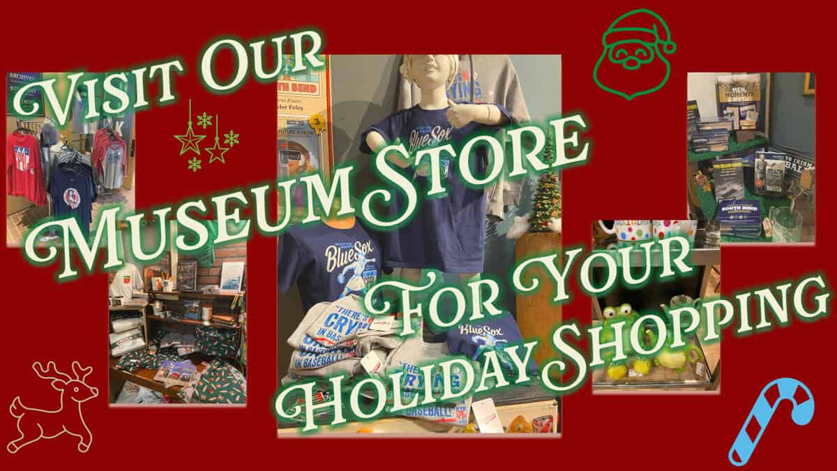 Blue Sox museum store merchandise display showcasing apparel, memorabilia, and holiday-themed items related to baseball history.