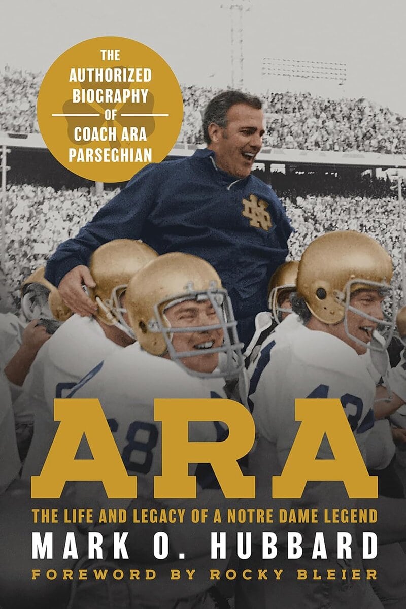 1. Biographical book cover of Coach Ara Parseghian smiling with football team, Notre Dame memorabilia, history of Notre Dame football legend, sports biography, and legacy.